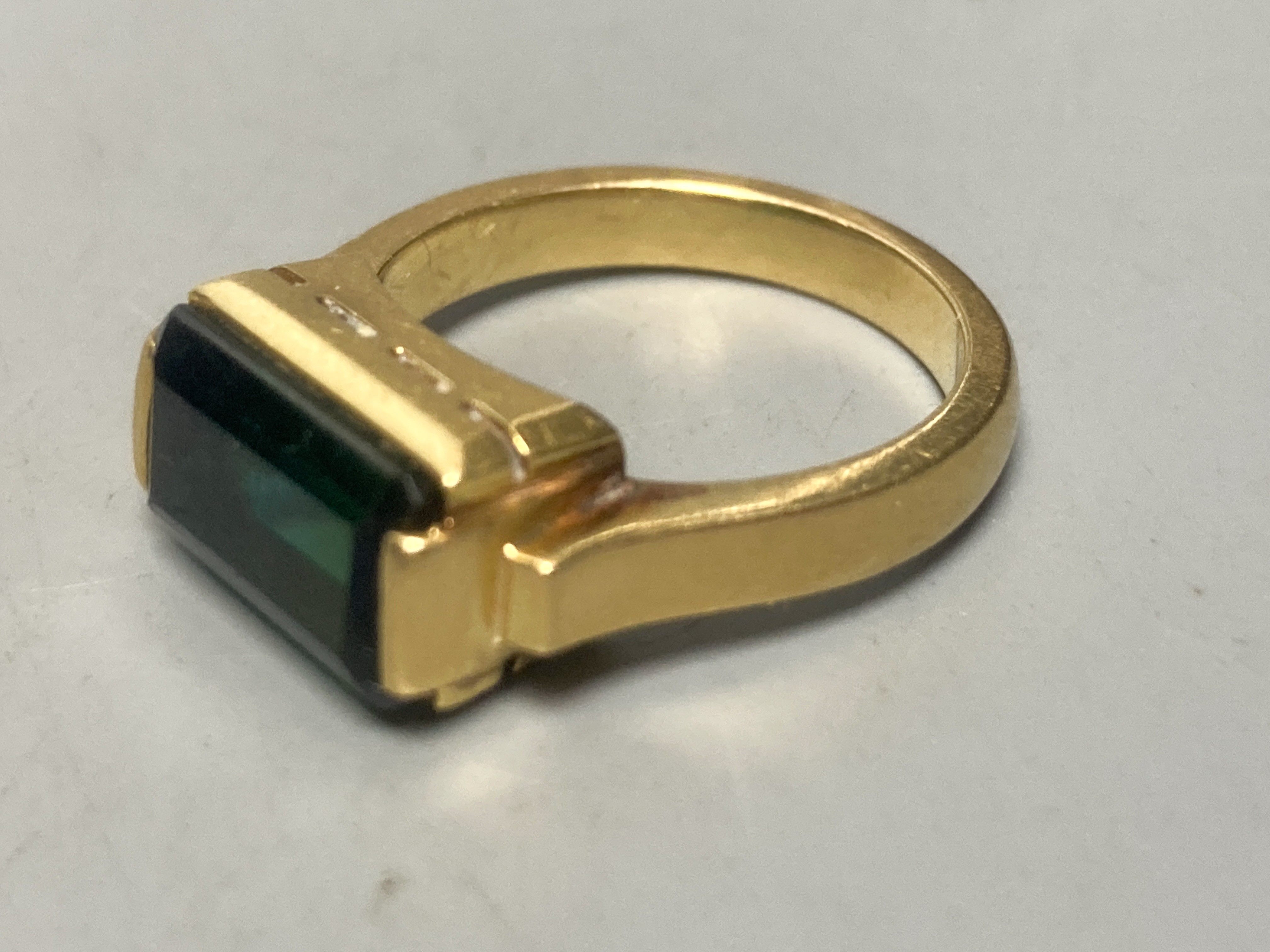 A Victorian 15ct gold buckle ring, size P/Q, 4.2 grams, three yellow metal and gem set dress rings, including amethyst, citrine and green tourmaline, gross 21.1 grams, an 18k deity pendant, 3.1 grams and a white metal an